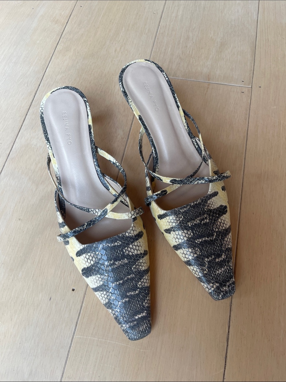 REJINA PYO
Snake Print Mules In Yellow